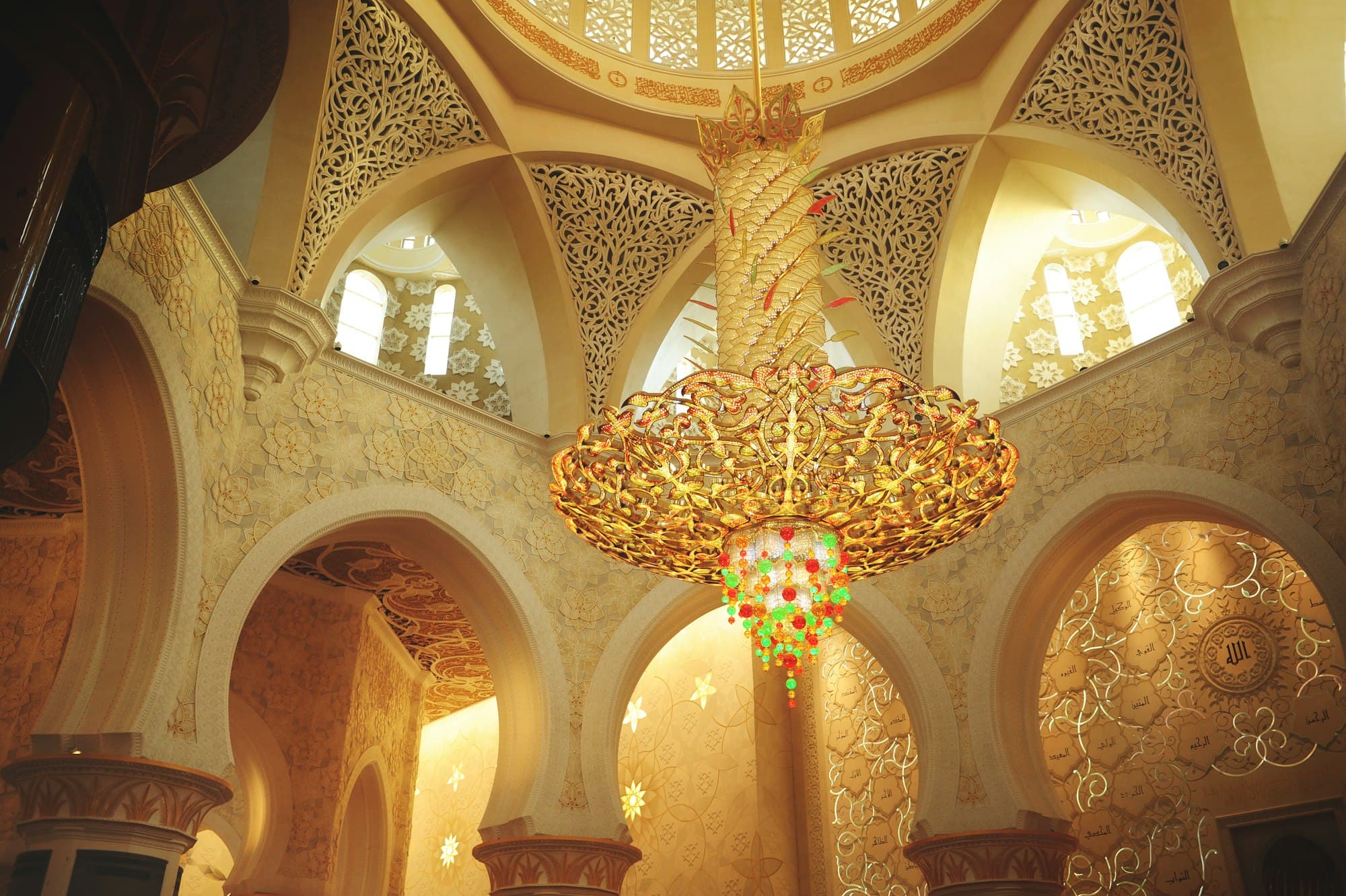 The ornate dome and chandelier of a mosque